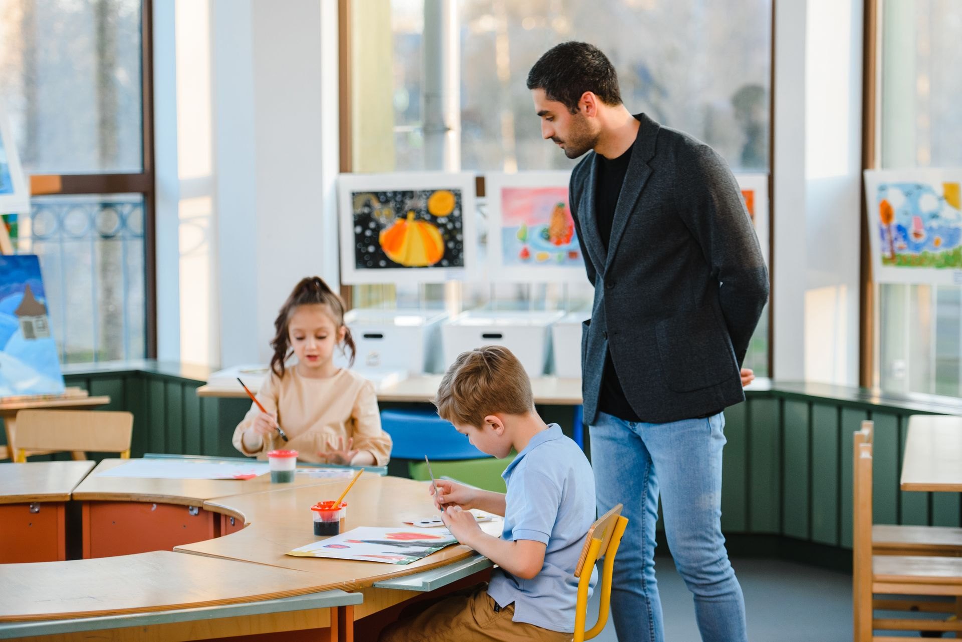 Children painting during an art class